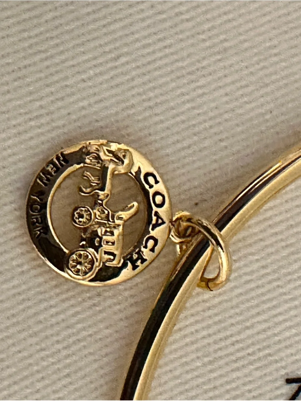 Coach delicate gold